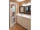 Bright bathroom with a double vanity, marble countertop, and a separate toilet and shower area at 295 Lakemont Dr, Roswell, GA 30075