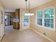 Dining area with large windows, leading to the kitchen and outdoor patio at 295 Lakemont Dr, Roswell, GA 30075