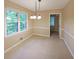 Bright dining area with tile flooring, large windows, and trim molding at 295 Lakemont Dr, Roswell, GA 30075