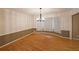 Open dining area with hardwood floors, natural light, and chandelier lighting at 295 Lakemont Dr, Roswell, GA 30075