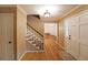 Welcoming foyer with hardwood floors, staircase, and access to other rooms in the home at 295 Lakemont Dr, Roswell, GA 30075
