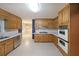 Traditional eat-in kitchen with stainless steel appliances, double oven, and ample cabinet space at 295 Lakemont Dr, Roswell, GA 30075