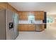 Kitchen featuring stainless steel appliances and light wood cabinetry at 295 Lakemont Dr, Roswell, GA 30075