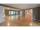 Spacious living room with a fireplace, large windows, hardwood floors, and an open floor plan at 295 Lakemont Dr, Roswell, GA 30075