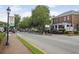 Street view with mature trees, street lights, sidewalks, and commercial building in the historic district at 295 Lakemont Dr, Roswell, GA 30075