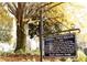 The Roswell Town Square sign near a large shade tree, circa 1840, in a historic area at 295 Lakemont Dr, Roswell, GA 30075