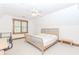 Bright bedroom featuring carpet, ceiling fan, and a classic wood trim at 529 Arnold Rd, Lawrenceville, GA 30044