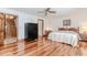Spacious bedroom with hardwood flooring and a large wardrobe for storage at 529 Arnold Rd, Lawrenceville, GA 30044