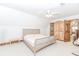Bright bedroom featuring carpet, ceiling fan, and wood trim at 529 Arnold Rd, Lawrenceville, GA 30044