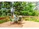 Spacious wooden deck with outdoor furniture surrounded by lush greenery at 529 Arnold Rd, Lawrenceville, GA 30044