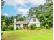 Charming two-story home with well-manicured lawn, beautiful landscaping, and mature trees at 529 Arnold Rd, Lawrenceville, GA 30044