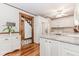 Bright kitchen features white cabinets, hardwood floors, and an open layout with modern appliances at 529 Arnold Rd, Lawrenceville, GA 30044