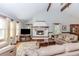 Inviting living room with a cozy fireplace, hardwood floors, and vaulted ceilings at 529 Arnold Rd, Lawrenceville, GA 30044
