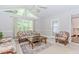 Bright living room with vaulted ceiling, seating area with floral sofas and natural lighting at 529 Arnold Rd, Lawrenceville, GA 30044