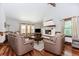 Bright living room with hardwood floors, fireplace, and large windows at 529 Arnold Rd, Lawrenceville, GA 30044
