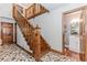 View of wood staircase with beautiful flooring leading to the second floor at 529 Arnold Rd, Lawrenceville, GA 30044