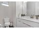 This half bath features white cabinets, a stylish sink, and a modern design at 687 Banton Nw Dr, Atlanta, GA 30318