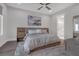 Bedroom featuring hardwood floors, decorative art piece and access to the bathroom at 687 Banton Nw Dr, Atlanta, GA 30318