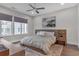 Bedroom with windows offering natural light, hardwood floors and decorative art piece at 687 Banton Nw Dr, Atlanta, GA 30318