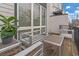 A cozy outdoor deck featuring modern seating and a leafy plant, perfect for relaxing or entertaining at 687 Banton Nw Dr, Atlanta, GA 30318