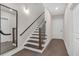 This hallway features wood floors, a staircase, and neutral walls at 687 Banton Nw Dr, Atlanta, GA 30318