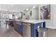 This kitchen features an island with seating, stainless steel appliances, and hardwood floors at 687 Banton Nw Dr, Atlanta, GA 30318