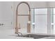 This modern kitchen features a stainless steel faucet and a bright window at 687 Banton Nw Dr, Atlanta, GA 30318