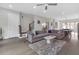 Spacious living area features a plush gray sofa, cozy rug, hardwood floors, and an open floor plan perfect for entertaining at 687 Banton Nw Dr, Atlanta, GA 30318