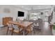 Spacious living and dining area with hardwood floors, modern lighting, and contemporary decor; perfect for entertaining at 687 Banton Nw Dr, Atlanta, GA 30318