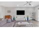 Bright, open living space featuring a comfortable sofa, modern decor, hardwood floors, and a large window at 687 Banton Nw Dr, Atlanta, GA 30318