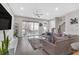 Open-concept living space with lots of light features a plush couch, hardwood floors, and modern decor with outdoor access at 687 Banton Nw Dr, Atlanta, GA 30318