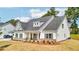 Beautifully landscaped front yard and cozy porch of this two-story home at 1411 Stephens View Dr, Loganville, GA 30052