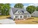 Well-maintained two-story home features a driveway and lush green lawn at 1411 Stephens View Dr, Loganville, GA 30052