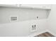 Clean and functional laundry room with hookups and storage space at 1411 Stephens View Dr, Loganville, GA 30052