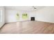 Light-filled living area features a fireplace and access to outdoor space at 1411 Stephens View Dr, Loganville, GA 30052