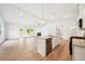 Bright and open living space connecting the kitchen, dining, and living areas at 1411 Stephens View Dr, Loganville, GA 30052