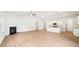 Open concept living area with a fireplace and adjoining kitchen space at 1411 Stephens View Dr, Loganville, GA 30052