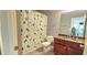Bathroom with tile floors, granite vanity, and shower with patterned curtain at 2700 Pine Tree Ne Rd # 3009, Atlanta, GA 30324