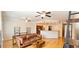 Bright living room with hardwood floors and ceiling fans leads to a kitchen with stainless steel appliances at 2700 Pine Tree Ne Rd # 3009, Atlanta, GA 30324