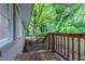 Backyard with wood deck, fence and lush greenery at 4029 Moffat Ct, Decatur, GA 30035
