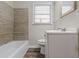 Bathroom features a tub and shower combo, wood floor, white vanity and mirror at 4029 Moffat Ct, Decatur, GA 30035