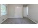 Bedroom with neutral walls, gray carpet, closet and window with natural light at 4029 Moffat Ct, Decatur, GA 30035