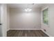 Well-lit dining room featuring dark hardwood floors and a charming chandelier at 4029 Moffat Ct, Decatur, GA 30035