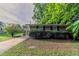 Charming single-story home with a covered carport, tidy landscaping, and a brick facade at 4029 Moffat Ct, Decatur, GA 30035