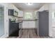 Modern kitchen featuring stainless steel appliances, granite countertops, and white cabinets at 4029 Moffat Ct, Decatur, GA 30035