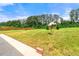 Large backyard featuring a basketball hoop, custom gazebo, and mature shade trees at 7495 Garnet Dr, Jonesboro, GA 30236