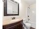 Bathroom boasts a vanity with a granite countertop and a shower-tub combination at 7495 Garnet Dr, Jonesboro, GA 30236