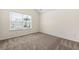 Bedroom featuring neutral carpet, a bright window, and lots of natural light at 7495 Garnet Dr, Jonesboro, GA 30236