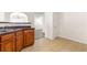 Kitchen area shows countertops, cabinetry, tile floors and leads into the dining room at 7495 Garnet Dr, Jonesboro, GA 30236