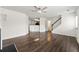 Spacious living room showcases hardwood floors, a fireplace, and an open staircase to the upper level at 7495 Garnet Dr, Jonesboro, GA 30236